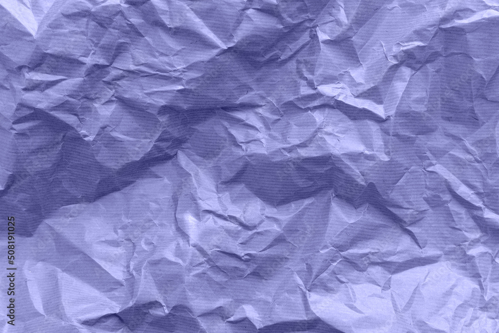Textured paper background. Recycled paper, crumpled paper. Violet toned. Very peri Textured paper background. Recycled paper, crumpled paper. Violet toned. Very peri