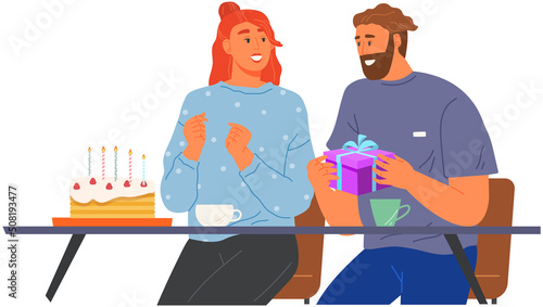 Man surprises his girlfriend or spouse with present in cafe. Couple on romantic date in restaurant. Guy giving gift to young lady. People in relationships spend time together for anniversary