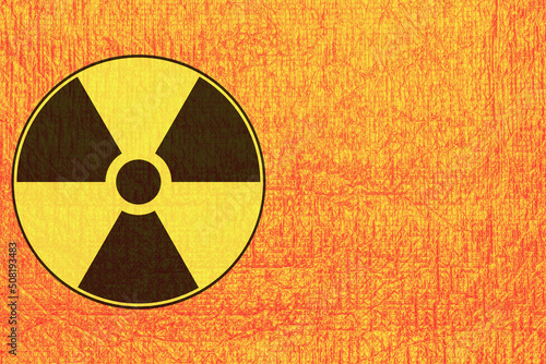 .Black and yellow sign of radiation hazard on an orange background