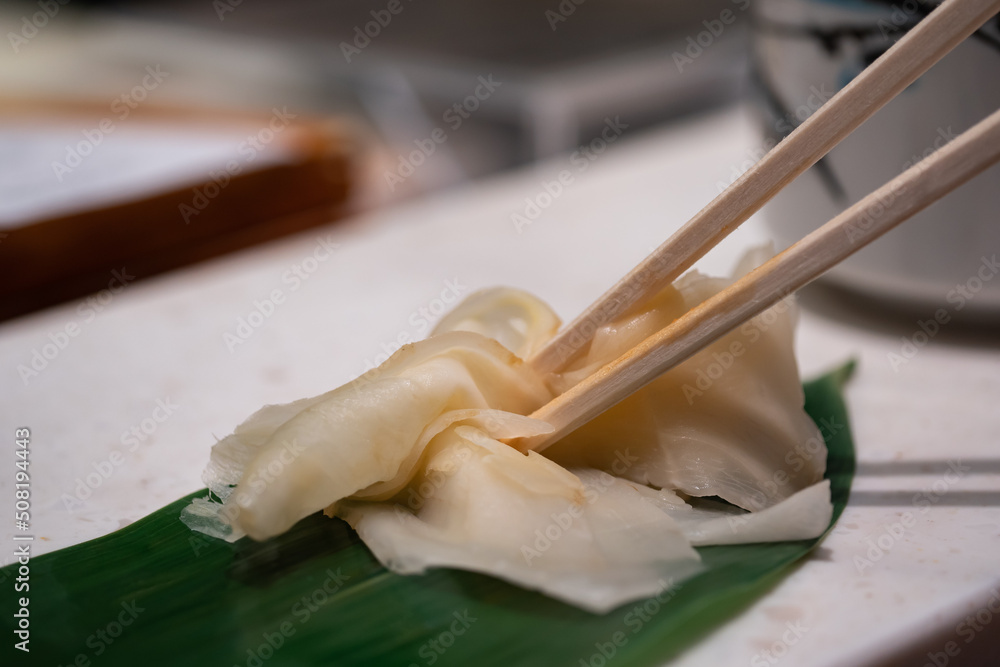 日本の寿司屋で出てくるガリ。甘酢漬けした生姜の料理。 Stock Photo | Adobe Stock