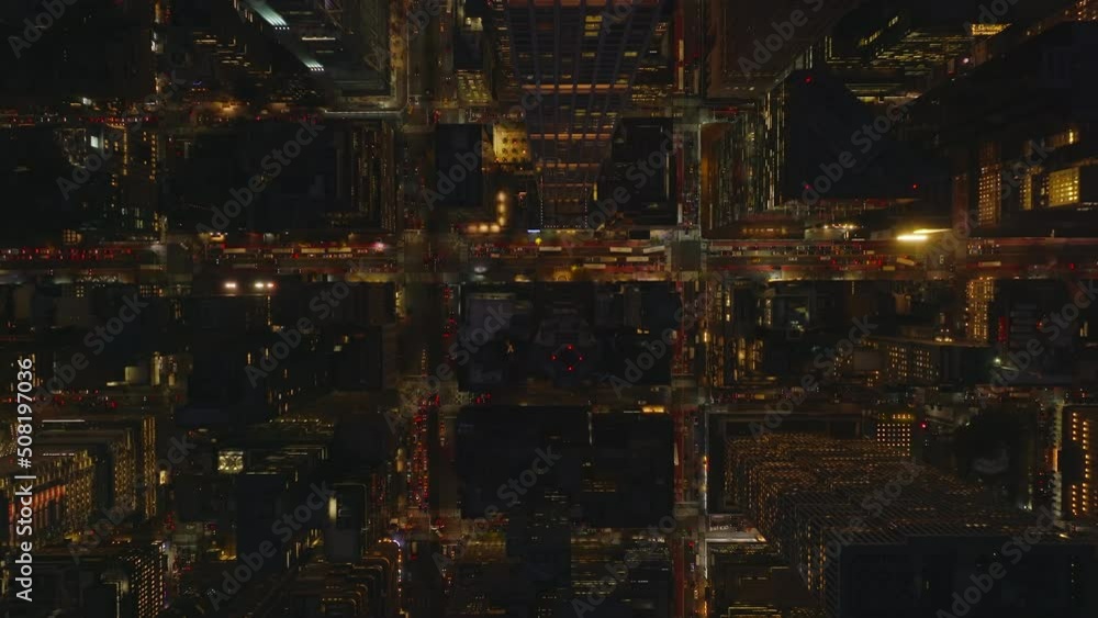 Aerial birds eye overhead top down panning view of evening downtown. Fly above tall modern apartment skyscraper. Manhattan, New York City, USA Aerial birds eye overhead top down panning view of evening downtown. Fly above tall modern apartment skyscraper. Manhattan, New York City, USA