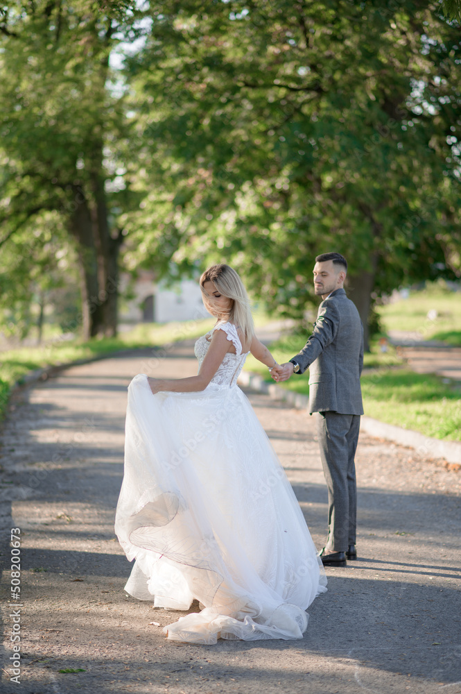 The bride and groom are in the back