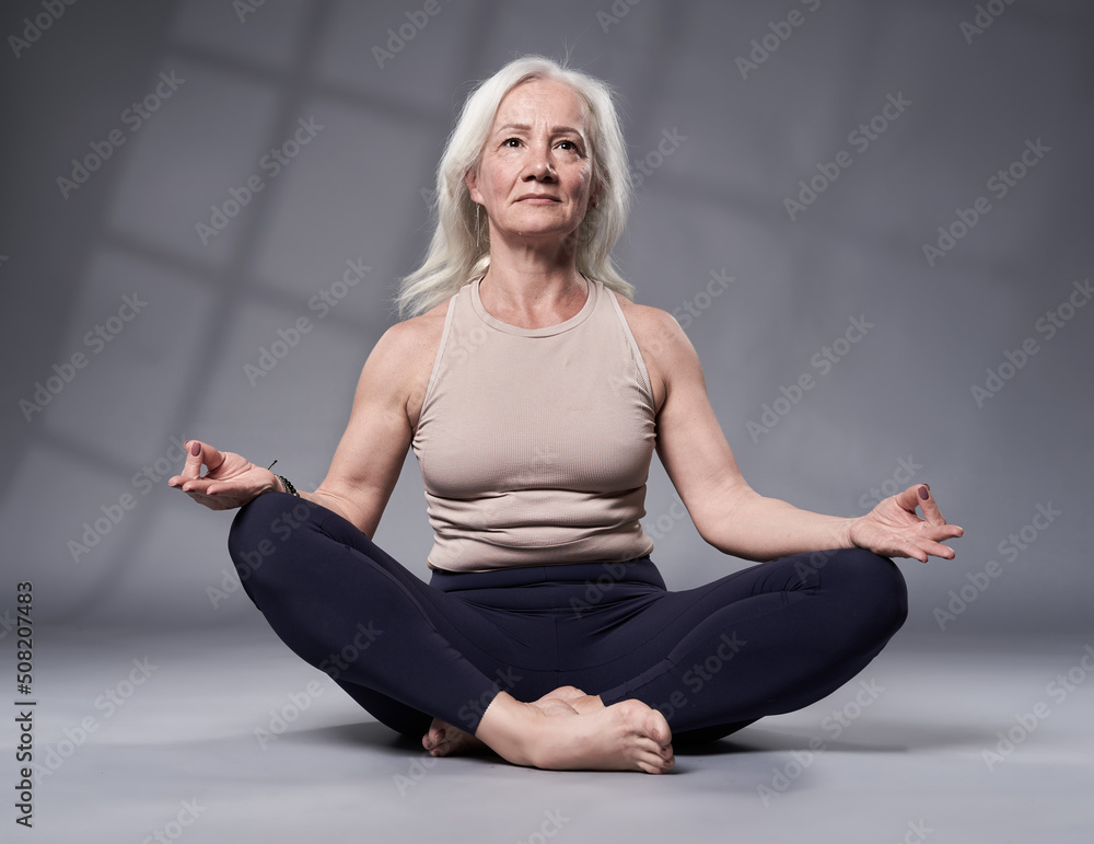Senior woman in yoga pose Senior woman in yoga pose