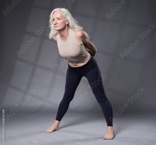 Senior woman in yoga pose