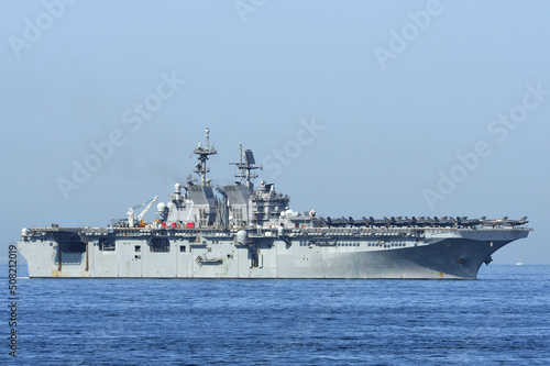United States Navy amphibious assault ship USS Tripoli sailing in Tokyo Bay. photo