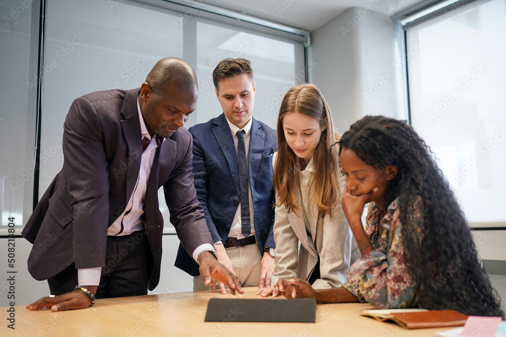 Business people in the workplace are discussing a working strategy for doing business Business people in the workplace are discussing a working strategy for doing business