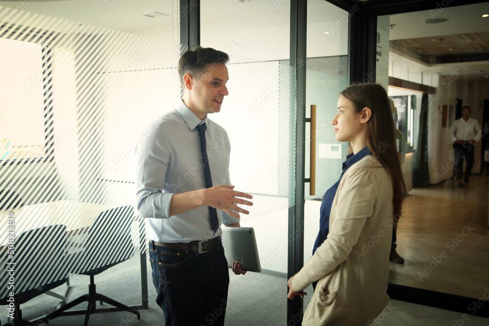 Business people in the workplace are discussing a working strategy for doing business Business people in the workplace are discussing a working strategy for doing business