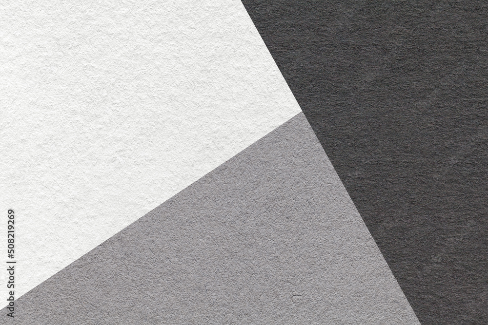 Texture of craft white, gray and black colors paper background, macro. Structure of vintage grey dense craft cardboard Texture of craft white, gray and black colors paper background, macro. Structure of vintage grey dense craft cardboard