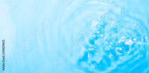 Blue gradient water background. Summer blue wave. Abstract or natural wavy water texture background. Defocus. The perfect backdrop for a presentation
