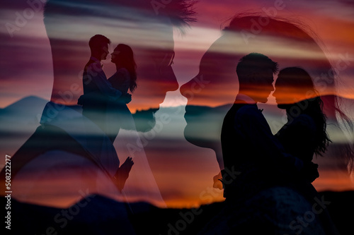 Silhouette of the bride and groom in an embrace at sunset