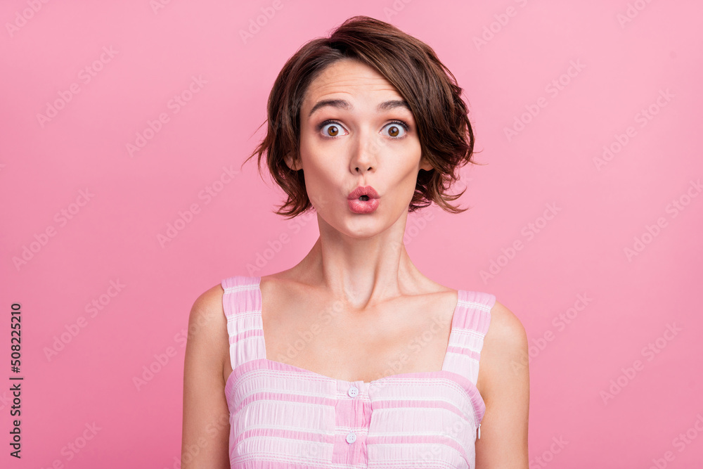 Photo of young pretty woman pouted lips unexpected face reaction fake information isolated over pink color background Photo of young pretty woman pouted lips unexpected face reaction fake information isolated over pink color background