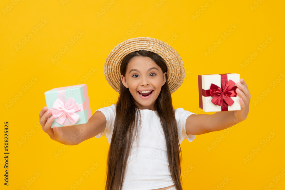 surprised teen girl hold present box on yellow background surprised teen girl hold present box on yellow background