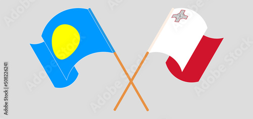 Crossed and waving flags of Palau and Malta