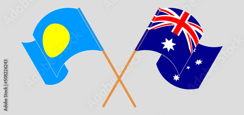 Crossed and waving flags of Palau and Australia
