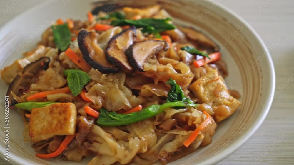 stir-fried noodles with tofu and vegetables - vegan and vegetarian food style stir-fried noodles with tofu and vegetables - vegan and vegetarian food style