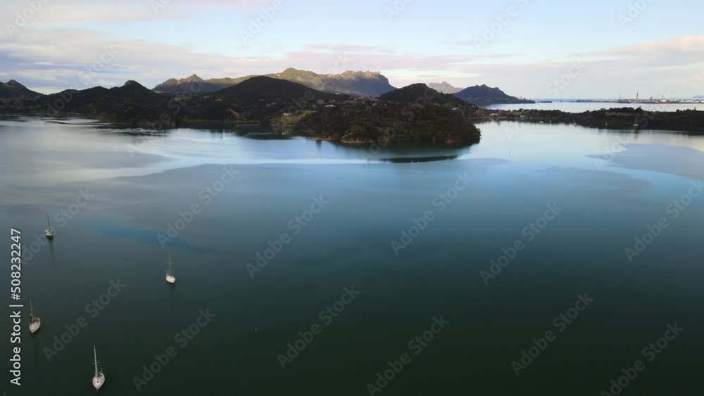 Cinematic flight over Parua bay marina with sail boats berthed below Cinematic flight over Parua bay marina with sail boats berthed below
