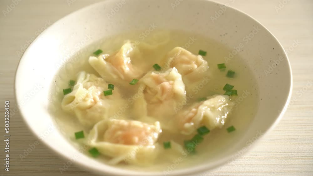 shrimp dumpling soup in white bowl - Asian food style shrimp dumpling soup in white bowl - Asian food style