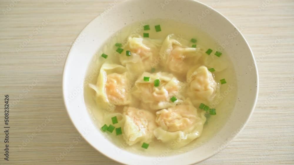 shrimp dumpling soup in white bowl - Asian food style shrimp dumpling soup in white bowl - Asian food style