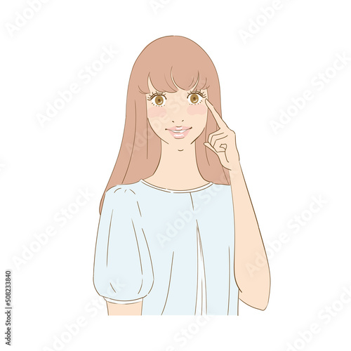 瞳を指差す笑顔の美しい女性
