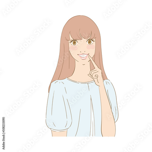 歯を指差す笑顔の美しい女性