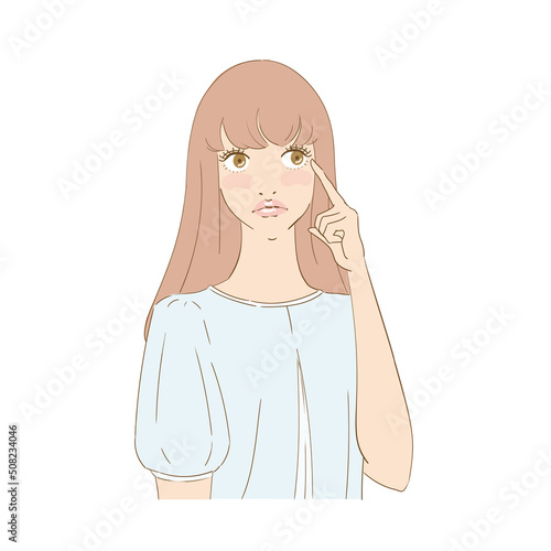 瞳を指差す困り顔の美しい女性