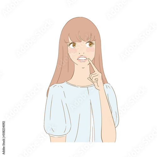 歯を指差す困り顔の美しい女性