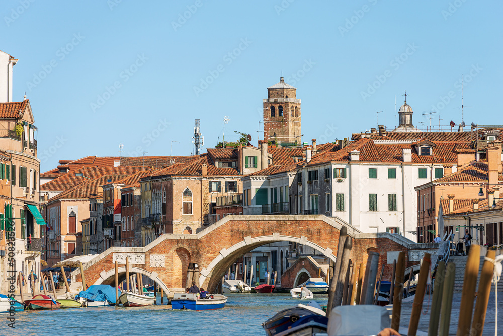 Bridge of the Three Arches (Ponte dei Tre Archi or di San Giobbe), 1688, over the Cannaregio canal of the Venetian lagoon. Veneto, Italy, Europe. On background the church of Saints Geremia and Lucia.