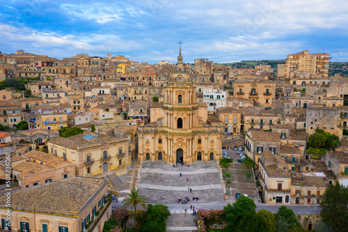 Duomo of San Giorgio in Modica, fine example of sicilian baroque art. Sicily, southern Italy. Modica (Ragusa Province), view of the baroque town. Sicily, Italy. photo