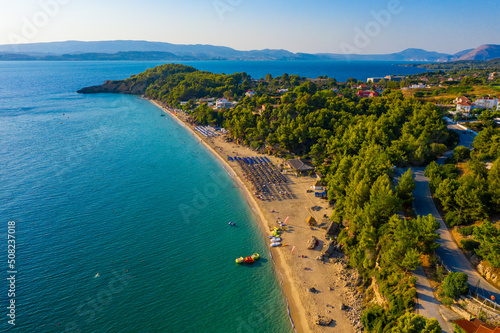 Platis Gialos beach at Argostoli of Kefalonia island in Greece. Spectacular view over beach of Platis Gialos near Lassi, Argostoli. Platis Gialos beach with soft sand and turquoise water in Lassi. photo