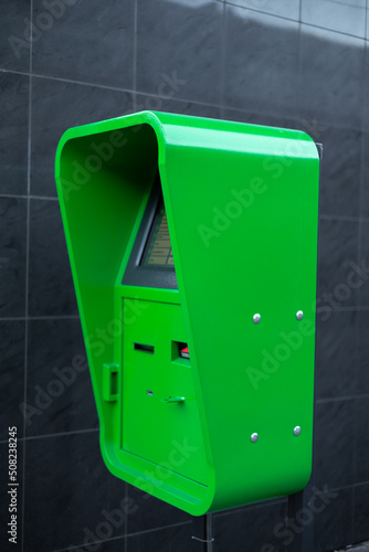 green ATM on the street