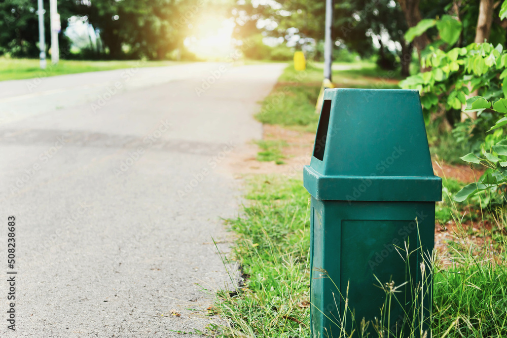Garbage bin on the roadside in the park Garbage bin on the roadside in the park
