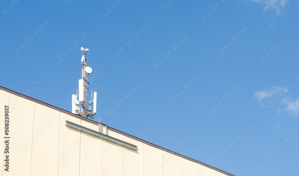 Cellular antenna on blue sky.Radio and mobile communication Cellular antenna on blue sky.Radio and mobile communication