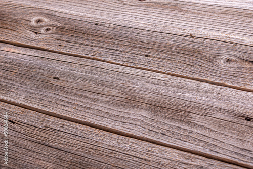 Old wood plank texture background. Old natural wooden shabby background closeup.