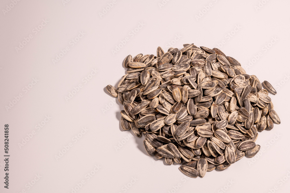 Sunflower seeds from above in white background - stock photo Sunflower seeds from above in white background - stock photo