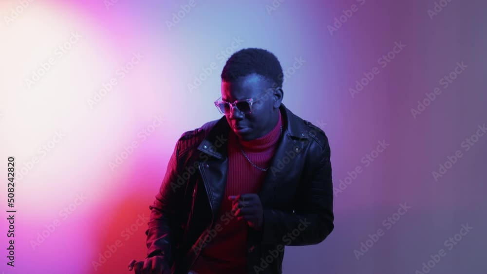 Fun dance. Neon party. Disco night. Boomerang motion. Happy excited carefree man enjoying weekend in colorful glowing light VJ loop. Fun dance. Neon party. Disco night. Boomerang motion. Happy excited carefree man enjoying weekend in colorful glowing light VJ loop.