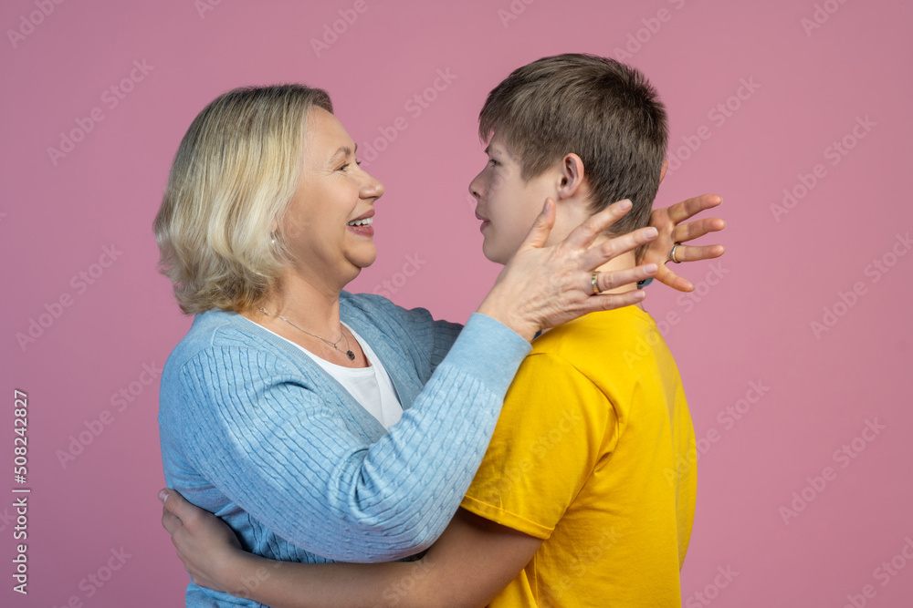 Son hugging mom facing each other Son hugging mom facing each other