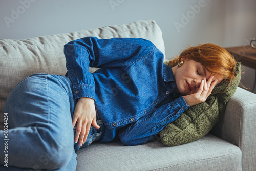 Obraz na płótnie Young sick woman with hands holding pressing her crotch lower abdomen