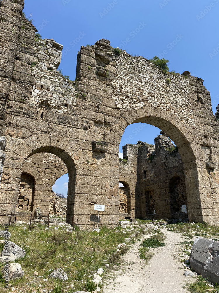 Roman amphitheater of Aspendos, Belkiz - Antalya, Turkey. Aspendos Ancient City. Aspendos acropolis city ruins, cisterns, aqueducts and old temple. 