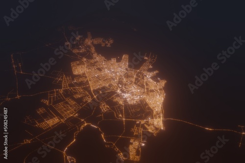 Aerial shot of Dammam (Saudi Arabia) at night, view from south. Imitation of satellite view on modern city with street lights and glow effect. 3d render photo