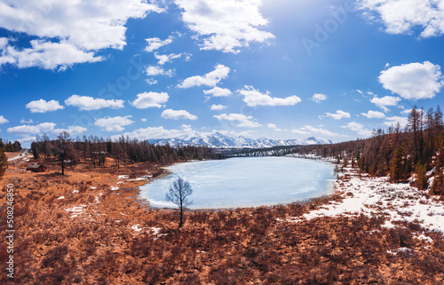 Beautiful autumn landscape Kidelu lake in Altai mountains Russia with sunlight. Aerial top view