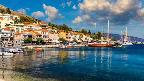 Agia Effimia, Kefalonia, Greece – September 18, 2019: View of street and harbor in Agia Effimia village on the Kefalonia Island (Ionian Island) in Greece.