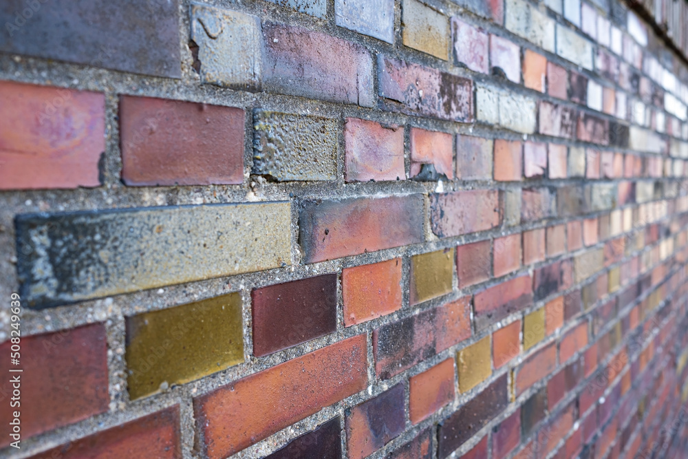 Old brickwork, some red bricks on the wall are painted, outdoors. Copy space. Abstract background. Old brickwork, some red bricks on the wall are painted, outdoors. Copy space. Abstract background.