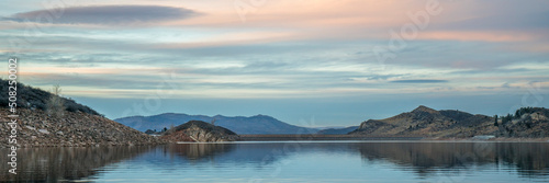 calm winter dusk over Horsetooth Reservoir in northern Colorado