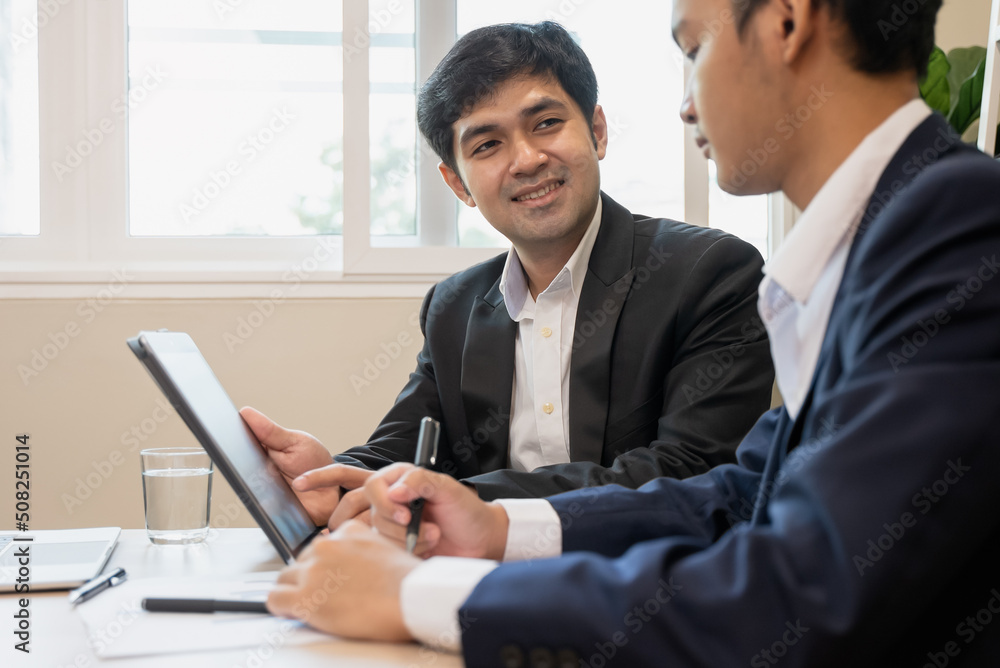 financial advisory services. Asian advisor showing plan of investment to clients in the consultancy office financial advisory services. Asian advisor showing plan of investment to clients in the consultancy office