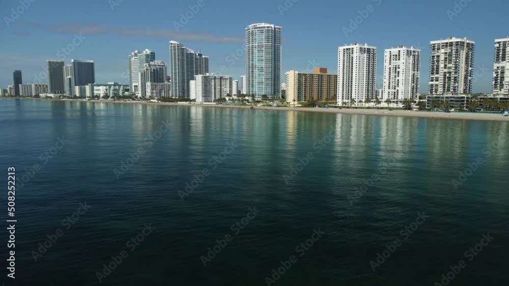 Aerial view of condos, apartment buildings and hotels with ocean views. The water is flat, calm on this tranquil day showing off this excellent South Florida tourist destination. Aerial view of condos, apartment buildings and hotels with ocean views. The water is flat, calm on this tranquil day showing off this excellent South Florida tourist destination.