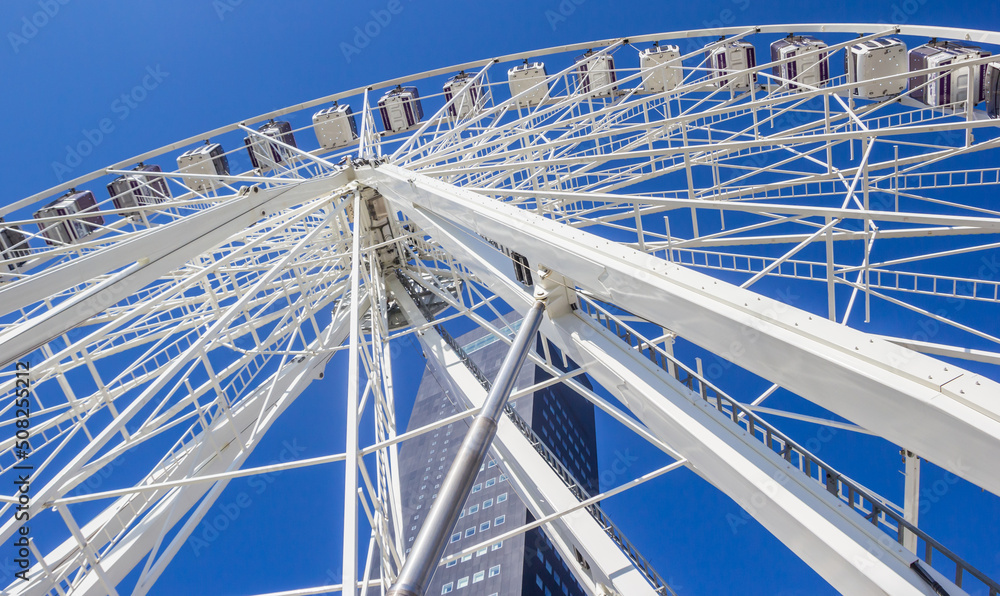 Ferris wheel in front of an office tower in Leeuwarden, Netherlands