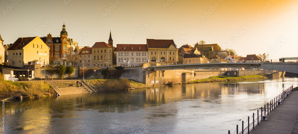 Panorama of evening light over the Saale river in Bernburg, Germany
