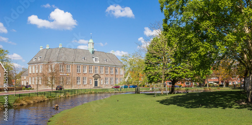 Panorama of the park and historic school building in Veendam, Netherlands photo