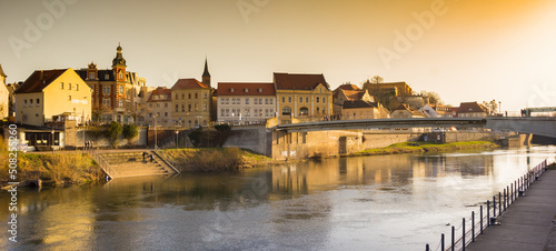 Obraz na płótnie Panorama of evening light over the Saale river in Bernburg, Germany w salonie