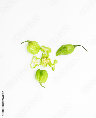 Spicy chili peppers or naga chili with chili powder isolate on white background, top view